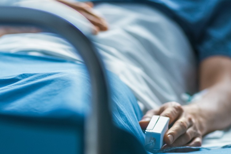 Patient in hospital bed Patient in hospital bed